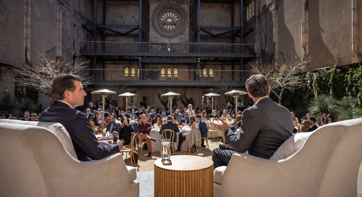 Matt Cimaglia, left, and Dan Hart, right, speak during the Phoenix Sister Cities Global Links Business Luncheon at Monroe Street Abbey on Feb. 19, 2026, in downtown Phoenix.